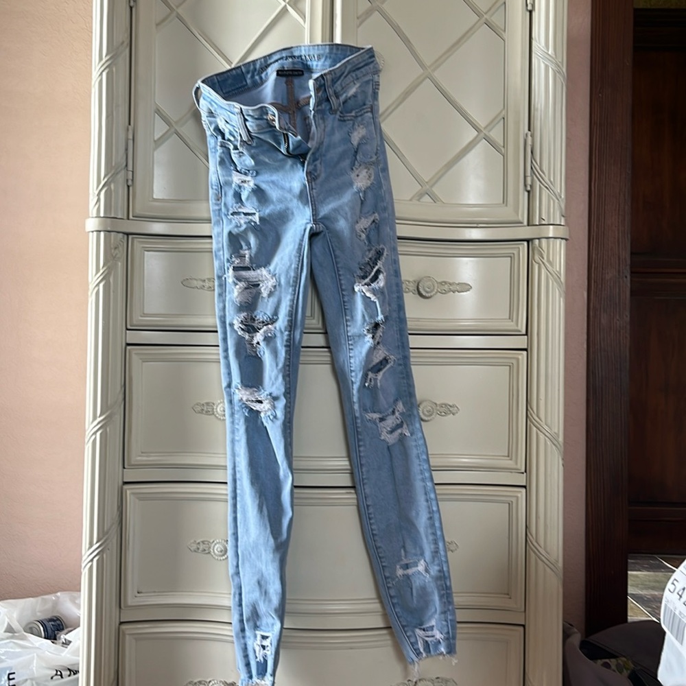 American Eagle jeans, size 0, light wash, patched rips, worn, good condition.